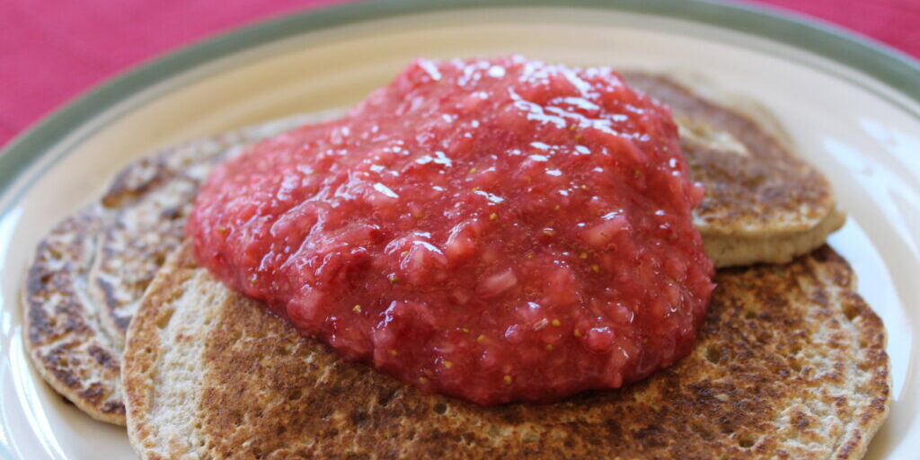 Raw Strawberry Sauce on Oatmeal Pancakes