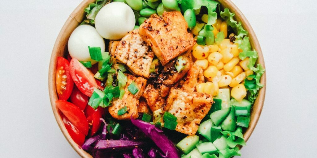 vegetables and salmon in a bowl